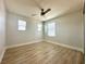Bedroom features three windows for natural light and a ceiling fan at 2648 Needlepoint St, Kissimmee, FL 34741