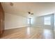 Large primary bedroom with luxury vinyl plank flooring, closet and natural light at 2648 Needlepoint St, Kissimmee, FL 34741