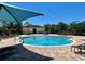 Enjoy a large community pool with seating and shade, perfect for relaxation and social gatherings at 2648 Needlepoint St, Kissimmee, FL 34741