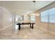 Large dining room with marble flooring, modern chandeliers, and big windows for ample natural light at 2648 Needlepoint St, Kissimmee, FL 34741