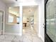 Inviting foyer with marble floors, an open floor plan, and a decorative glass front door at 2648 Needlepoint St, Kissimmee, FL 34741
