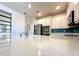 Modern kitchen with white countertops, stainless steel appliances, and island with sink at 2648 Needlepoint St, Kissimmee, FL 34741