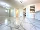 Open living area with tile floors and modern lighting at 2648 Needlepoint St, Kissimmee, FL 34741