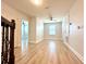 Bright living room featuring wood floors, a ceiling fan, and plenty of natural light at 2648 Needlepoint St, Kissimmee, FL 34741