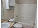 This is a bathroom featuring a tub with shower, toilet, and vanity with sink at 266 Paradise Woods Ct, Davenport, FL 33896