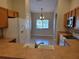 Bright kitchen featuring wood cabinets, modern appliances, and view of the dining area at 266 Paradise Woods Ct, Davenport, FL 33896