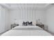 Comfortable bedroom with unique ceiling detail, soft lighting, and neutral color scheme at 2725 Serenity Meadow Dr, Kissimmee, FL 34744