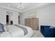 Well-lit bedroom with stylish decor, a ceiling fan, and a view into the ensuite bathroom at 2725 Serenity Meadow Dr, Kissimmee, FL 34744