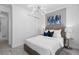 A bedroom with an elegant light fixture, closet, and windows at 2725 Serenity Meadow Dr, Kissimmee, FL 34744