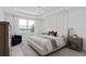 Inviting bedroom featuring decorative ceilings, a large window with water views, and elegant furnishings at 2725 Serenity Meadow Dr, Kissimmee, FL 34744