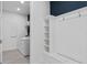 A well-lit laundry room featuring a mudroom and laundry machines at 2725 Serenity Meadow Dr, Kissimmee, FL 34744