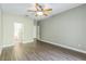 Bedroom featuring wood-look floors and ensuite bathroom at 2765 Eldred Ct, Apopka, FL 32712