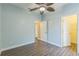 This is a spacious bedroom with wood-look floors and a ceiling fan at 2765 Eldred Ct, Apopka, FL 32712