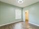 This bedroom features wood-look floors, a window, and a closet at 2765 Eldred Ct, Apopka, FL 32712