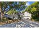 Charming single-story home with mature trees and a well-manicured lawn at 2765 Eldred Ct, Apopka, FL 32712