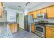 The well-lit kitchen features stainless appliances and granite countertops at 2765 Eldred Ct, Apopka, FL 32712