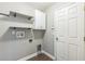 Functional laundry room with shelving and hookups at 2765 Eldred Ct, Apopka, FL 32712