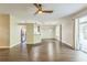 Spacious living room showcasing wood-look floors and an open view to the kitchen at 2765 Eldred Ct, Apopka, FL 32712