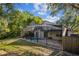 This screened-in pool area, complete with a brick patio and lush greenery, creates an ideal space for relaxing and entertaining at 2765 Eldred Ct, Apopka, FL 32712