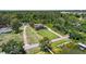 Wide aerial view of property lines, home, and surrounding area near the lake at 2825 Lakeshore Dr, Mount Dora, FL 32757