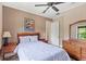 Cozy bedroom featuring a queen-size bed, wooden furniture, neutral walls, and a serene atmosphere for relaxation at 2825 Lakeshore Dr, Mount Dora, FL 32757