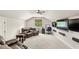 Spacious bonus room features a comfortable seating area and a desk with built-in media at 2825 Lakeshore Dr, Mount Dora, FL 32757
