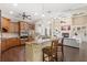Gourmet kitchen with custom cabinets, granite countertops and an island with seating at 2825 Lakeshore Dr, Mount Dora, FL 32757