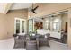 Outdoor lanai features a dining area and views into the home's interior spaces at 2825 Lakeshore Dr, Mount Dora, FL 32757