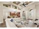 Open living room with high ceilings, built-in shelving, and seamless flow to the kitchen at 2825 Lakeshore Dr, Mount Dora, FL 32757