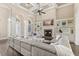 Elegant living room featuring a fireplace, built-in shelving, and coffered ceiling at 2825 Lakeshore Dr, Mount Dora, FL 32757