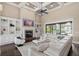 Inviting living room with a fireplace, custom built-ins, and oversized window at 2825 Lakeshore Dr, Mount Dora, FL 32757