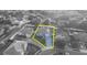 Aerial view of a charming two-story home with a well-kept lawn surrounded by lush trees within a quiet neighborhood at 2860 Falconhill Dr, Apopka, FL 32712