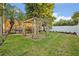 Backyard featuring a pergola and lush green grass at 2860 Falconhill Dr, Apopka, FL 32712