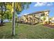 Backyard with a screened-in lanai and mature landscaping at 2860 Falconhill Dr, Apopka, FL 32712