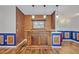 A fully furnished bar area featuring copper tiles, pendant lights, and wood details at 2860 Falconhill Dr, Apopka, FL 32712