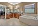 Bright primary bathroom with soaking tub and lots of counter space at 2860 Falconhill Dr, Apopka, FL 32712