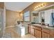 Spacious bathroom with dual vanities, soaking tub, and separate shower at 2860 Falconhill Dr, Apopka, FL 32712