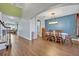 Elegant dining room showcasing hardwood floors, stylish lighting, and comfortable seating at 2860 Falconhill Dr, Apopka, FL 32712