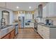 Well-equipped kitchen with stainless steel appliances, ample cabinetry, and modern lighting at 2860 Falconhill Dr, Apopka, FL 32712
