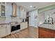 Modern kitchen features stainless steel appliances, white subway tile backsplash, and wood flooring at 2860 Falconhill Dr, Apopka, FL 32712