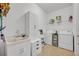 Laundry room with a sink, washer, and dryer at 2860 Falconhill Dr, Apopka, FL 32712
