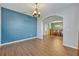 Spacious living room with hardwood floors, neutral walls, and an open layout at 2860 Falconhill Dr, Apopka, FL 32712