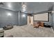 Modern media room with a projector screen, soft lighting, and comfortable seating at 2860 Falconhill Dr, Apopka, FL 32712