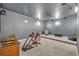 Cozy carpeted theater room with soft lighting, comfortable seating, and surround sound at 2860 Falconhill Dr, Apopka, FL 32712