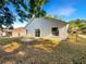 Backyard of home with mature trees, patio, and a peaceful setting at 30442 Pga Dr, Sorrento, FL 32776