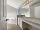 Well-lit bathroom featuring a soaking tub, vanity with countertop space, and ample natural light at 30442 Pga Dr, Sorrento, FL 32776