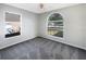 Bedroom with neutral walls and carpet, and updated windows at 30442 Pga Dr, Sorrento, FL 32776