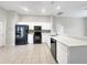 Bright kitchen featuring white cabinets, modern appliances, and a functional layout at 30442 Pga Dr, Sorrento, FL 32776