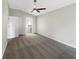 Spacious main bedroom with plush carpeting, ceiling fan, and ensuite bathroom at 30442 Pga Dr, Sorrento, FL 32776