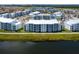 Resort community with multiple buildings, lake view, green spaces and ample parking at 3151 Paradox Cir # 108, Kissimmee, FL 34746